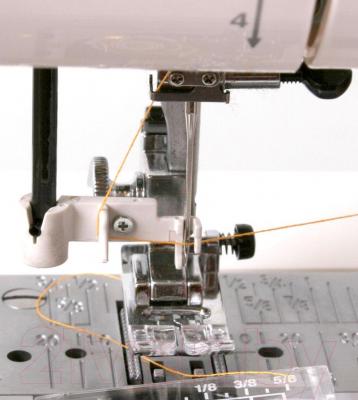 Швейная машина Janome 6260QC / QC2325 - нитевдеватель