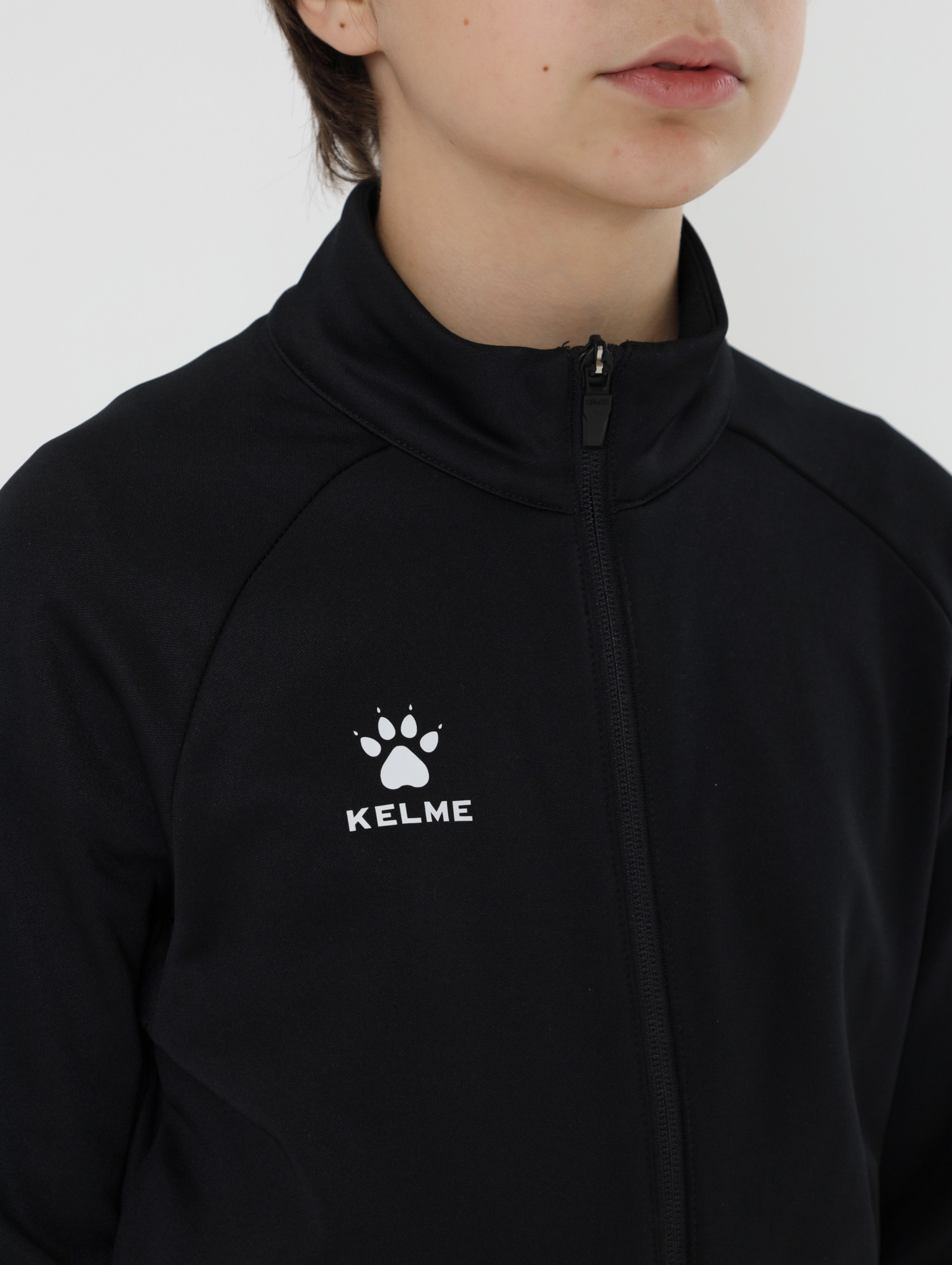 Олимпийка спортивная детская Kelme Children's Knitted Jacket fleece / 7461WT3143-000 (р.140, черный) — фото 6