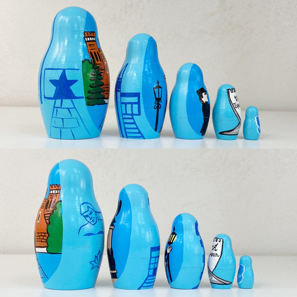 Изображение товара Матрешка сувенирная Брестская Фабрика Сувениров Достопримечательности Бреста на синем фоне 5177bl