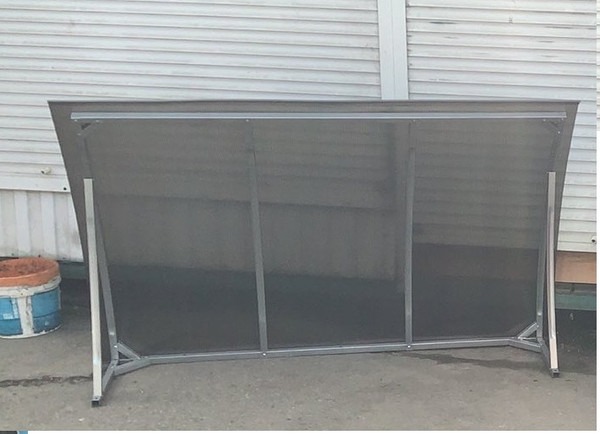 Изображение товара Козырек ИМпласт Скат Цинк 1800х950 Тонированный / 15069 (с сотовым поликарбонатом 4мм, бронза)