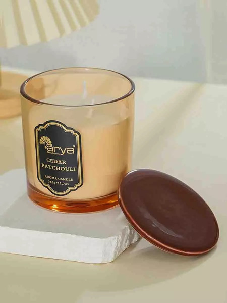 Изображение товара Свеча Arya Ароматическая Cedar Patchouli / 8680943254351 (янтарь)