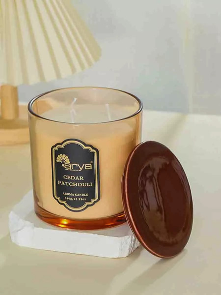 Изображение товара Свеча Arya Ароматическая Cedar Patchouli / 8680943254344 (янтарь)