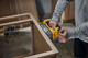 Миниатюра изображения товара Профессиональная ленточная шлифмашина DeWalt DCW220NT