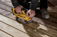 Миниатюра изображения товара Профессиональная ленточная шлифмашина DeWalt DCW220NT